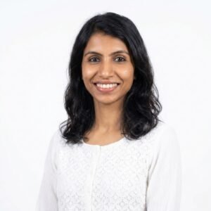 Create professional headshot on a white background from this attached photo 11 (10)