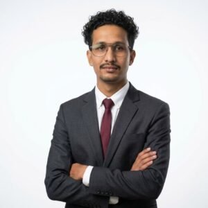 Create professional headshot on a white background from this attached photo 11 (12)