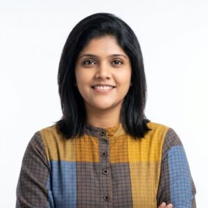 Create professional headshot on a white background from this attached photo 11 (16)